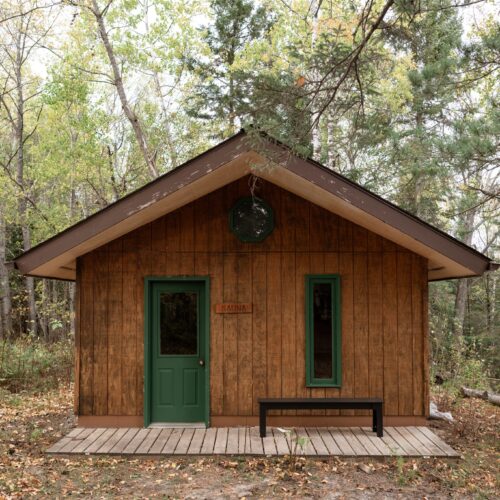 Relax in a classic cedar sauna nestled among towering evergreens.