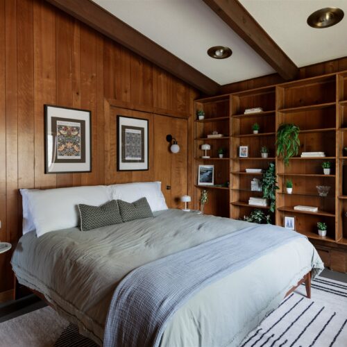 A warm, wood-wrapped king room overlooking the quiet Northwoods.