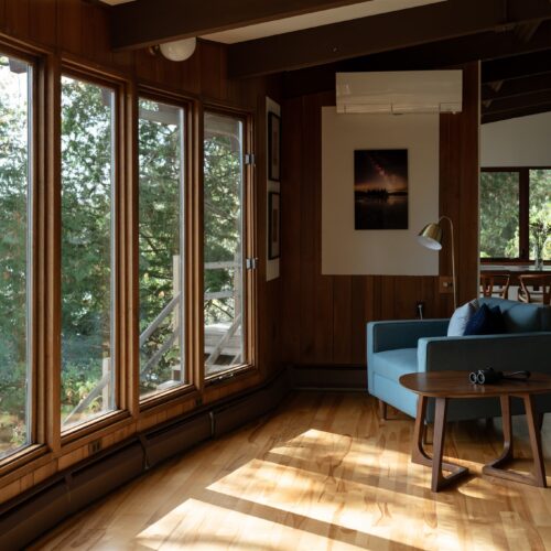 A cozy reading nook overlooking the lake—your perfect slow-morning spot.