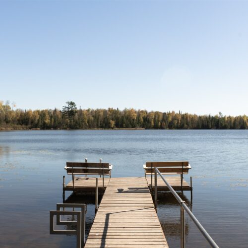 A tranquil dock with stunning sunrise and sunset views.