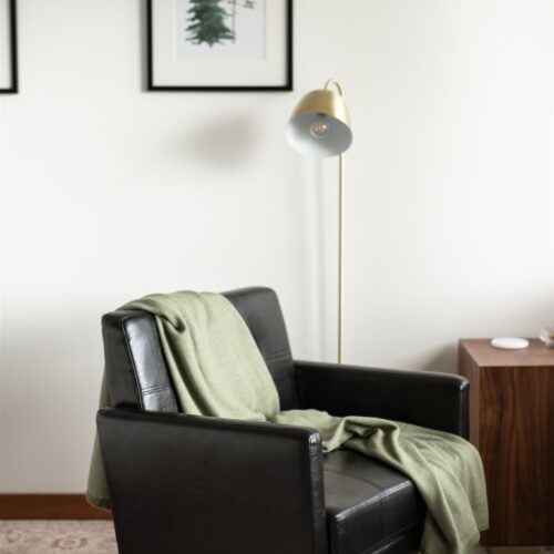 A cozy reading chair perfectly positioned for sunrise reflections.