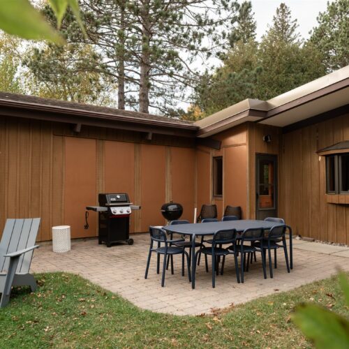 Lakeside dining table with room for everyone and a grill for easy meals overlooking the lake.