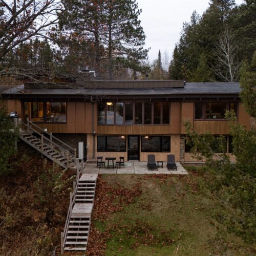Mid-century design meets secluded Northwoods serenity.